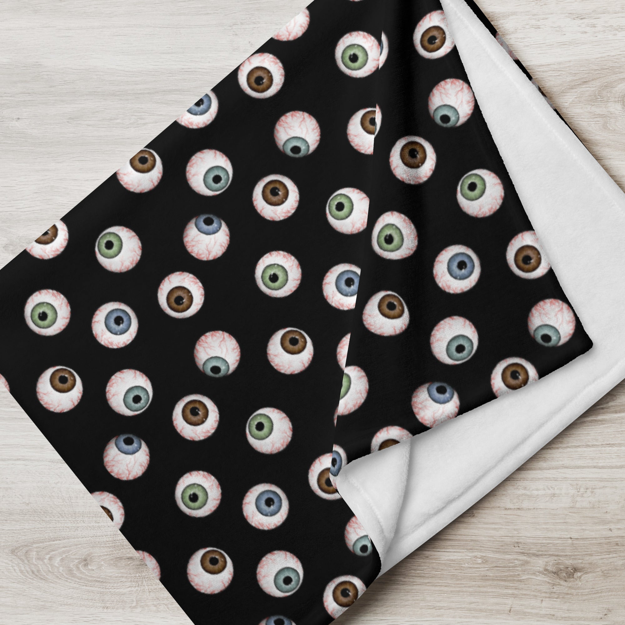 close up view of 60" x 80" eyeballs throw blanket in black